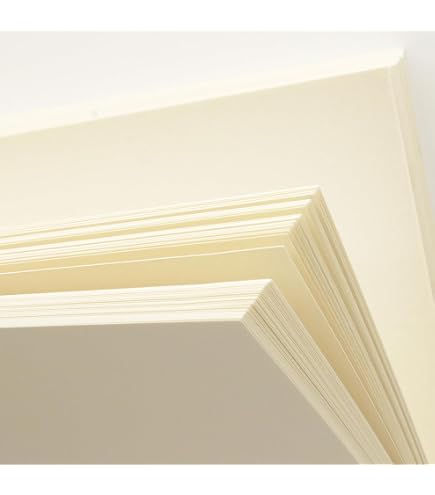 Supplied paper inspiration showing stacks of ivory paper sheets.